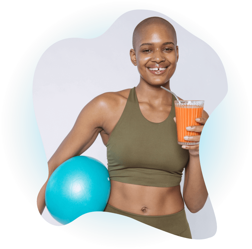 Woman smiling with a glass of fruit juice