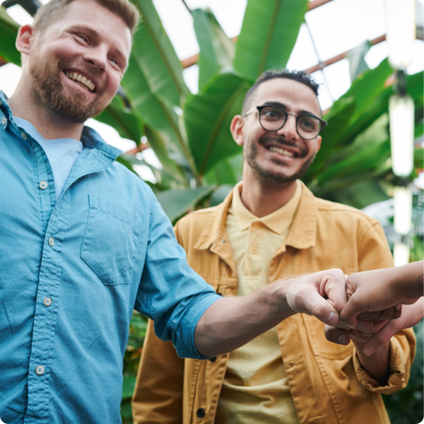 Health Loft dietitians for general health nutrition Two friends greeting others with a fist bump