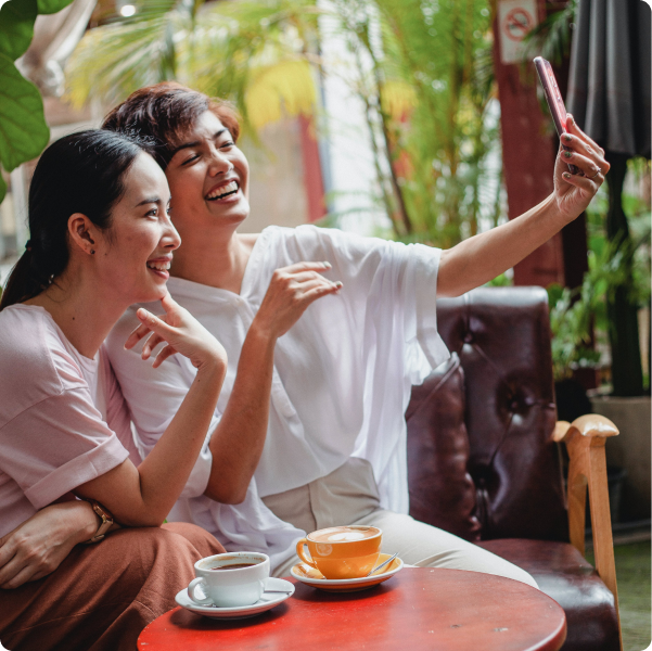 Health Loft dietitians for PCOS nutrition Two women smiling for a selfie together over coffee