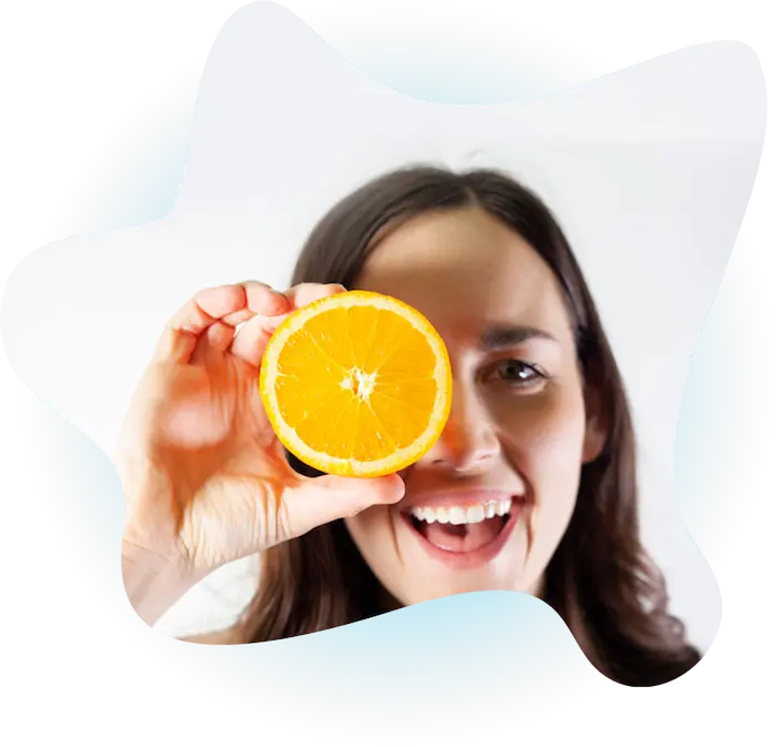 woman holding orange woman holding orange